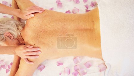 Photo for Senior woman, hands of masseuse and back massage with physical therapy at spa, healing and wellness for stress relief. Self care, treatment and skin with top, bodycare and relax at resort with calm. - Royalty Free Image