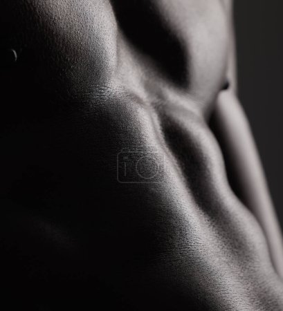 Photo for Fitness, man and torso with closeup in studio for wellness, stomach and body on dark background. Person, muscle and bodybuilder with six pack and muscular, healthy lifestyle with muscles and topless. - Royalty Free Image