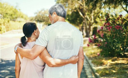 Photo for Back, hug and a senior couple on a walk for bonding, love and exercise in the morning. Happy, relax and an elderly man and woman in the street together for romance in retirement or a marriage. - Royalty Free Image