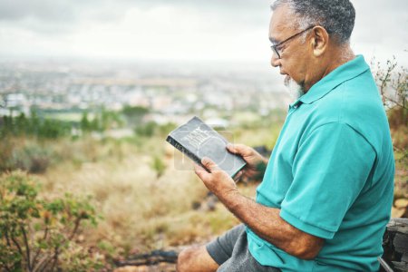 Photo for Senior man, bible and reading in nature, thinking or peace for mindfulness, faith or spiritual knowledge. Mature person, Christian book and ideas with gratitude, religion or connection to holy spirit. - Royalty Free Image