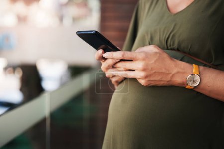Photo for Hands, phone and pregnant woman typing in home, reading email notification and social media. Pregnancy, smartphone and closeup of mother on internet search for baby news, scroll website or mobile app. - Royalty Free Image
