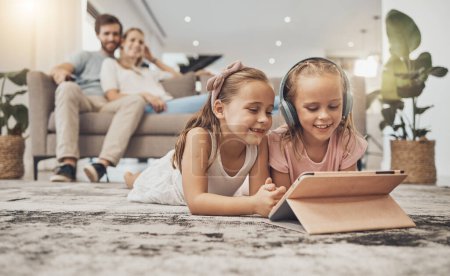 Photo for Happy parents, siblings and children with tablet on floor in living room for entertainment together at home. Mom, dad and kids in lounge with technology for relax, enjoying or streaming at house. - Royalty Free Image