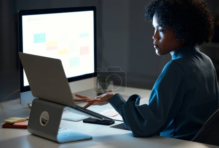 Photo for Woman with laptop, night and checking schedule, agenda and reminder for office administration. Online calendar, diary and girl at dark desk planning spreadsheet for time management on computer screen. - Royalty Free Image