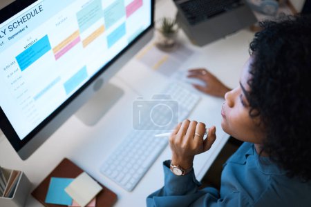 Photo for Woman with computer, thinking and checking schedule, agenda and reminder for office administration. Online calendar, planner and girl at desk planning spreadsheet for time management with high angle - Royalty Free Image