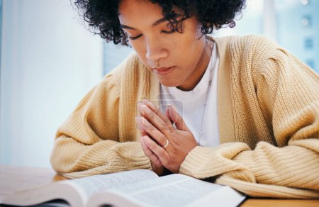 Photo for Bible, praying and woman in home for religion, Christian worship or reading to study. Person, holy book and meditation at desk for God, Jesus Christ and faith in spiritual gospel, praise and hope. - Royalty Free Image