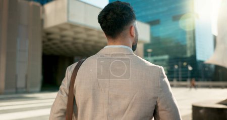 Photo for Urban, back and corporate person walking on outdoor journey, commute trip and real estate agent on way to career job. New city, opportunity and consultant on morning travel to work. - Royalty Free Image