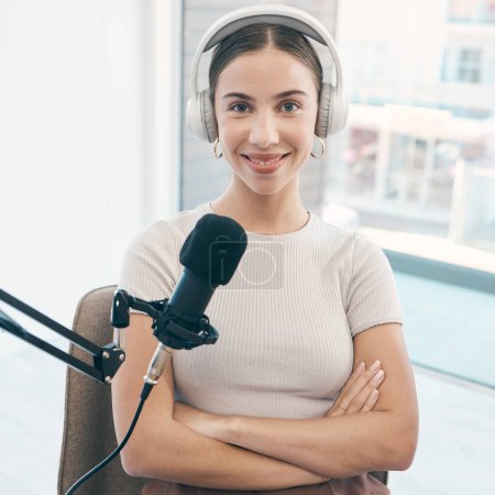 Photo for Radio presenter, portrait and happy woman with arms crossed in a booth for live streaming, broadcast or reporting. Speech, face and proud female talk show host smile in a studio for news announcement. - Royalty Free Image