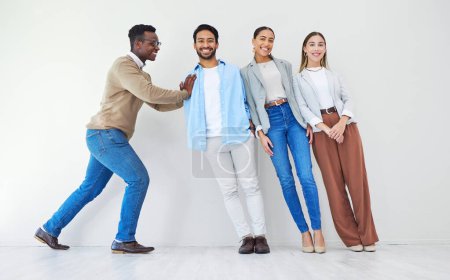 Photo for Black man pushing team of business people, portrait and smile in office together for synergy. Strong professional support group of employees, solidarity for collaboration and cooperation in startup. - Royalty Free Image
