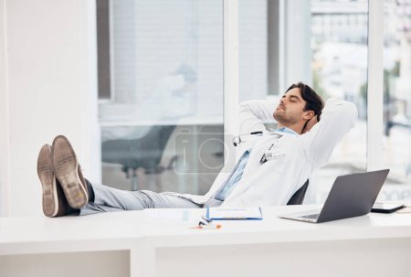 Photo for Man, doctor and sleeping in relax for done, completion or finished at hospital office. Tired male person or medical surgeon chilling on break, rest or asleep lying with feet on work desk at clinic. - Royalty Free Image
