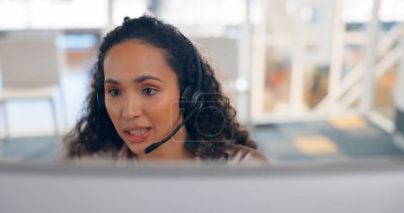 Photo for Face, computer and a woman in a call center for customer service or support with a headset microphone. Contact us, crm or telemarketing with a young consultant talking for help or assistance. - Royalty Free Image