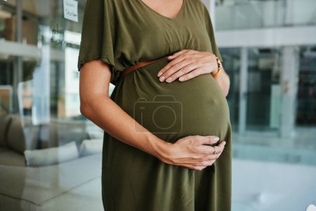 Photo for Pregnancy care, stomach and hands of woman feeling, massage and touch baby development, body or belly. Maternity, office closeup and pregnant person love, support and hope for future motherhood. - Royalty Free Image