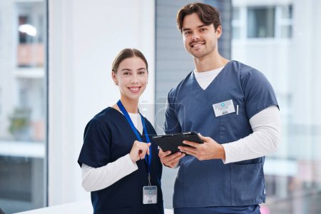 Photo for Portrait of doctors, man and woman with tablet in hospital with smile, healthcare and teamwork. Happy medical professional, nurse and surgeon with digital app for research, health insurance and pride. - Royalty Free Image