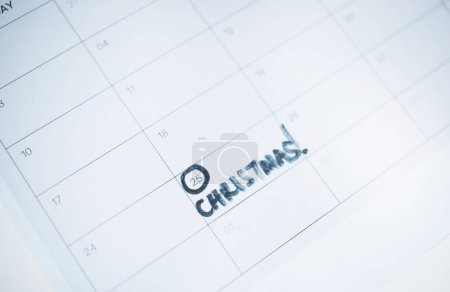 Photo for Christmas, date or calendar countdown number or paper planning, holiday vacation or preparation. Planner design, note or days important reminder for event, tradition or festive season for appointment. - Royalty Free Image