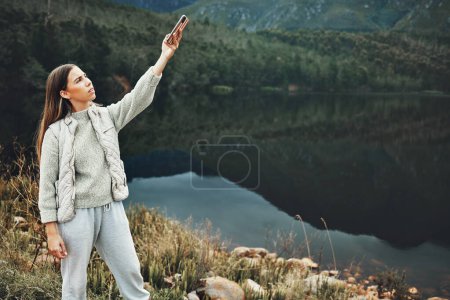 Photo for Connection, search and woman hiking with phone, problem or poor signal, glitch or error in nature. Smartphone, 404 or lady explorer confused with reception fail, network or location guide app issue. - Royalty Free Image