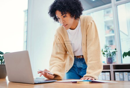 Photo for Woman with laptop, notes and standing in office with admin documents, internet and ideas for freelance project. Remote work, web report and girl with computer, research paperwork and writing schedule. - Royalty Free Image