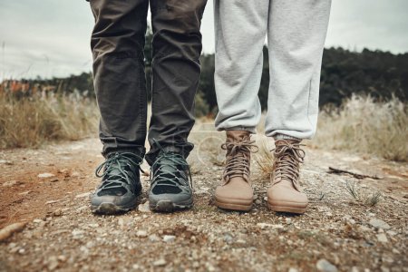 Photo for Feet, hiking and couple on mountain road with travel, holiday and adventure together outdoor. Shoes, journey and climbing in nature with walking, fitness and wellness for trekking with people. - Royalty Free Image