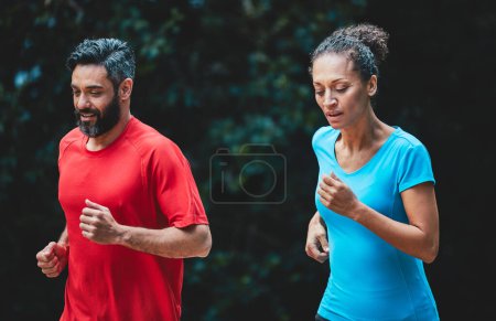 Photo for People, running outdoor for exercise and health in park, support and training for marathon with cardio. Runner, athlete and sport with couple in nature, challenge and fitness with workout for race. - Royalty Free Image