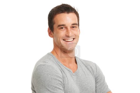 Photo for Portrait, smile and a confident man in studio isolated on a white background for fashion or style. Happy, wellness and satisfaction with a young model looking relaxed in a casual clothes outfit. - Royalty Free Image