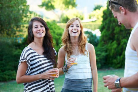 Photo for Happy, friends and drinks in backyard of home with juice, laughing and conversation in garden. BBQ, young people with talking group with smile outdoor with discussion and funny joke ready for summer. - Royalty Free Image