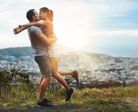 Photo for Kiss, lift or happy couple hug in nature for outdoor date, love or trust with support, bond or freedom. Romantic man, care or woman excited by holiday vacation together to celebrate, relax or travel. - Royalty Free Image