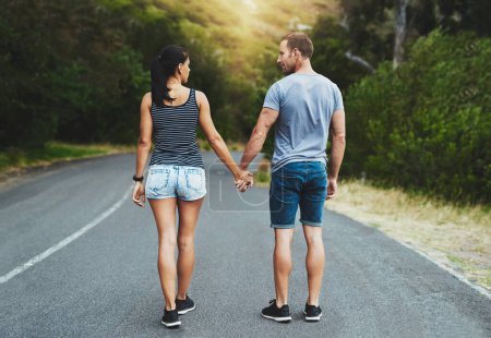 Photo for Street, love or happy couple holding hands or walking on date with trust, care for romance or adventure. Loyalty, road or man with woman on holiday vacation together for bond, support or wellness. - Royalty Free Image
