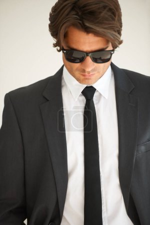 Photo for Business, attitude and confident man in office with glasses, attitude or empowered on wall background. Leader, mindset and cool male entrepreneur thinking, edgy and posing with leadership or focus. - Royalty Free Image