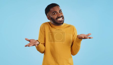 Photo for Confused, hands and face of man in studio with dont know, gesture or ask on blue background. Why, portrait and guy model with oops, mistake or doubt, unsure or forget, guess or palm scale questions. - Royalty Free Image