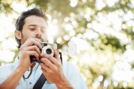 Photo for Camera, photographer or man in park on holiday vacation trip for creativity, shooting or tourism memory. Photography, travel or male tourist with pictures for sightseeing or trees in nature in summer. - Royalty Free Image