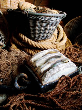 Photo for Closeup of fishing basket, lines and rope, net and storage of traditional equipment at port. Tools, fishery and mesh, vintage wood and old metal, retro cordage and antique fishnet in industry. - Royalty Free Image
