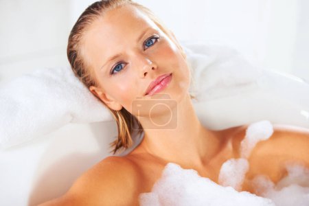 Photo for Calm, woman and bath portrait with skincare, cleaning and shampoo treatment with cosmetics. Wellness, bubble and home of a female person with soap in a bathroom for hair wash and relax with foam. - Royalty Free Image
