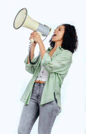 Photo for Woman, megaphone and protest leader in studio with shouting, noise and politics by white background. Isolated African girl, student and audio tech for justice, speech and change in human rights goals. - Royalty Free Image