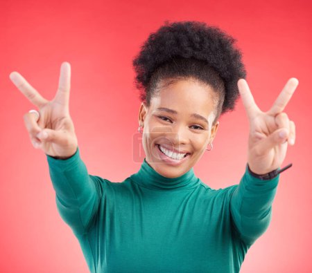 Photo for Happy, portrait and black woman with peace hands in studio with thank you, vote or feedback on red background. V, sign and African lady with good vibes, smile and freedom emoji, support or self love. - Royalty Free Image