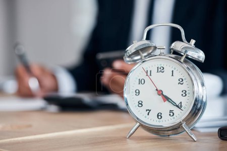Photo for Business man, clock and time management in an office for deadline, punctual and busy schedule. Professional person or broker working at desk with an alarm, reminder and timer for goals and agenda. - Royalty Free Image