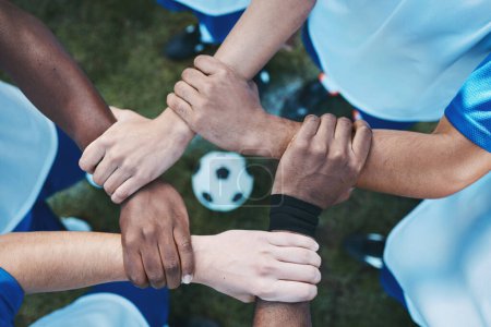Photo for Sports, teamwork and support with hands of soccer player on field for fitness, support and community. Goal, workout and mission with people training on football stadium for motivation and game. - Royalty Free Image