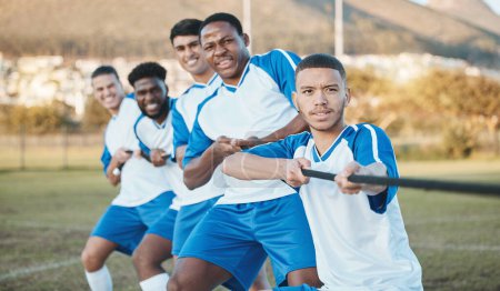 Photo for Soccer player, men and tug of war on field with teamwork, strong and muscle, fitness and competition challenge. Male athlete group, football training and diversity, trust and team building in sports. - Royalty Free Image