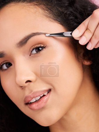 Photo for Face, closeup and woman with tweezer for eyebrow, beauty and grooming for skincare. Natural portrait, facial plucking and hair removal of model for self care, wellness or aesthetic for cosmetics - Royalty Free Image