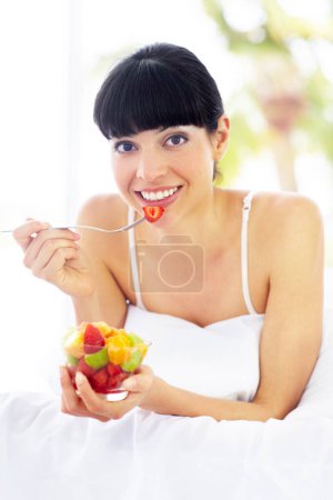 Photo for Fruit salad, home bed and portrait of happy woman with organic meal, snack or morning breakfast for healthy lifestyle balance. Apartment bedroom, strawberry benefits or relax person eating vegan food. - Royalty Free Image