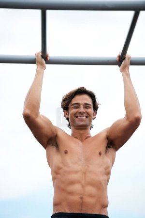 Photo for Pull up bar, happiness and man exercise for muscle building, bodybuilder performance or outdoor strength development. Fitness, sports training and athlete happy for workout, challenge or practice. - Royalty Free Image