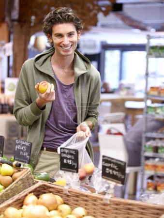 Photo for Man, portrait and fruit shopping in grocery store for fibre nutrition, vegan food and healthy choice. Male person, smile and peach bag supermarket for organic health diet, vitamins or happy customer. - Royalty Free Image