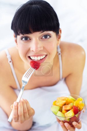 Photo for Fruit salad, eating or portrait of happy woman with a morning breakfast or lunch diet in home. Smile, gut health or healthy vegan girl with fruits, snack or food bowl meal to lose weight or wellness. - Royalty Free Image