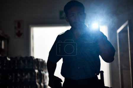 Photo for Flashlight, police and man in dark for investigation, inspection and property search at night. Surveillance, law and security male person with torch in room for safety, crime and protection service. - Royalty Free Image