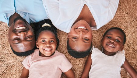 Photo for Above, parents or portrait of happy kids on floor in house or home bonding or playing as a black family. Faces, mother or African father relaxing with kids, girls or siblings with smile, care or love. - Royalty Free Image