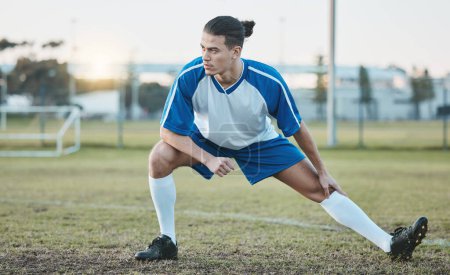 Photo for Thinking, sports or soccer player stretching legs on football field in training, exercise or workout in Brazil, Fitness, warm up or serious male athlete ready to start practice match or stadium game. - Royalty Free Image