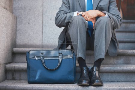Photo for Lawyer, briefcase and man shoes on city and urban steps of government building outdoor. Businessman, justice and luggage for professional work of employee on a break of legal career of a attorney. - Royalty Free Image