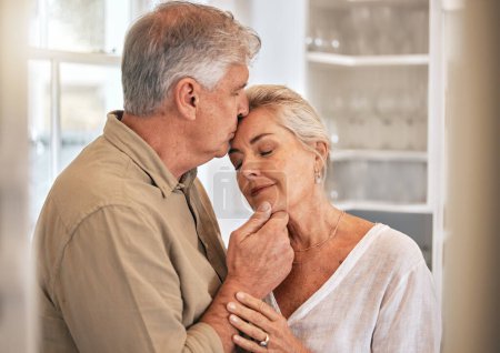 Photo for Home, kiss and senior couple with love and commitment while together for quality time and bonding. Elderly woman and a man relax in a room with care, support and security in a healthy marriage. - Royalty Free Image