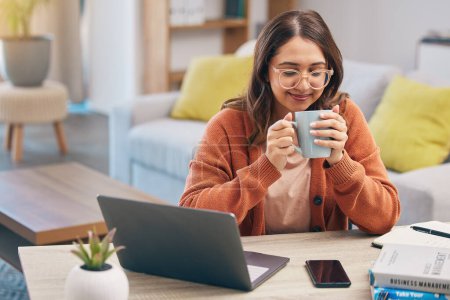 Photo for Happy woman, student and coffee by desk for morning study, knowledge or education at home. Female person or freelancer in relax enjoying or drinking beverage for studying scholarship in living room. - Royalty Free Image