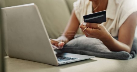 Photo for Credit Card, laptop and hands of person online shopping for discount, fintech service or ecommerce sales. Web store search, savings transfer payment and closeup customer banking on home lounge sofa. - Royalty Free Image