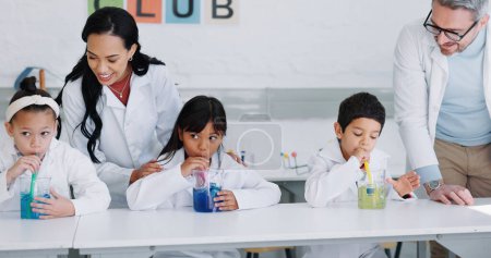 Photo for Education, science and kids in class for an experiment while learning chemistry together at school. Study, laboratory and innovation with student children in a classroom for growth or development. - Royalty Free Image