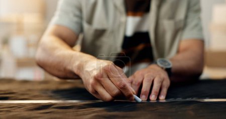 Photo for Closeup, hands and a tailor with clothes for measure, fitting or a design on fashion. Workshop, chalk line and designer, stylist or seamstress with manufacturing or production and creative on fabric. - Royalty Free Image