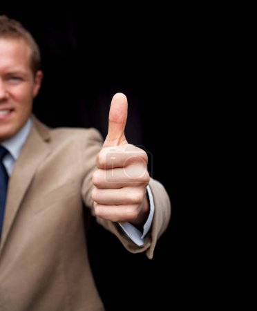 Photo for Closeup, thumbs up and smile for business man, hand or agreement in portrait by black background. Entrepreneur, happy or sign language for support, thanks or icon for vote, choice or decision on deal. - Royalty Free Image
